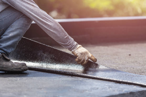 Professional Basement Waterproofing technician working in East Amherst, NY